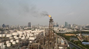Fire on flare stack oil and gas central processing platform while burning toxic and release over pressure from process emergency shut down. environment sound.