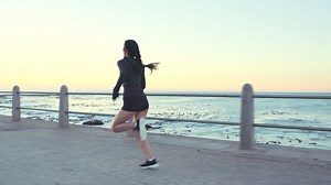 Woman running, beach and sports training Premium Stock Video Footage