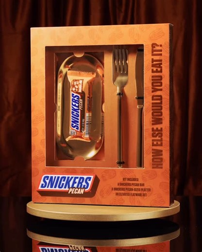 Introducing the SNICKERS® Pecan Flatware Worthy Set: for a SNICKERS Bar so exquisitely composed, it demands to be savored. Includes a SNICKERS Pecan bar, a perfectly sized platter, and an elegant fork and knife for when hunger needs a deluxe reset. For a chance to purchase this limited-edition set, visit snickers.com/pecanflatware or click the link in bio. | SNICKERS
