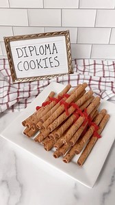 🎓📜 Diploma Cookies are SO cute and so easy! There’s no cooking or baking at all and you just need 2 ingredients: rolled wafer cookies and Twizzlers Pull 'N' Peel licorice. How fun would these be for a graduation party?! #graduationparty #cookies #partyfood #easyrecipes | The Soccer Mom Blog - Positive Inspiration for Moms