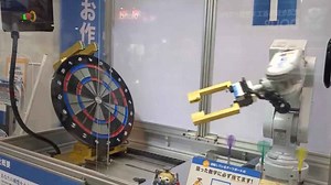 Impressive moment robot plays dart game