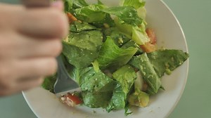 Eating salad with a fork - Free Stock Video