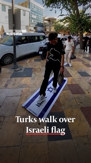 2.2M views · 157K reactions | Turkish pedestrians were seen walking over an Israeli flag laid on the street. | Yeni Şafak | Facebook