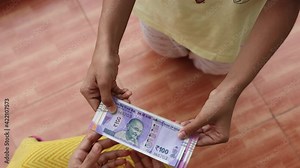 Counting Indian currency Rupee , hand giving Indian money 100, 200, 2000 rupees banknote Kerala India 4K slow motion video, footage. Business woman borrowing money cash new Indian currency notes