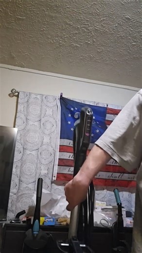 Man Picks Up Vacuum Cleaner With One Hand