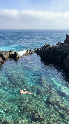 woman swimming in natural pool