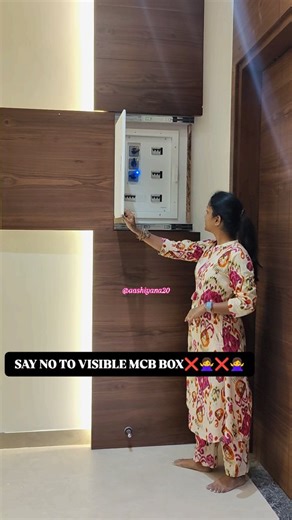 Aashiyana by Anita Roshan | Interior Designer in Erode on Instagram: "🌸🌸HIDDEN ELEMENT SERIES🌸🌸 No More Ugly Boxes! The Secret to a Sleek Look✨️✨️ Tired of that unstichtly MCB box ruining your home's aesthetic? That's why we created a clever solution - a hidden MCB box seamlessly integrated into a beautiful wooden panel! This design is not only functional (it hides that pesky electric box!), but it's also elegant and easily accessible with a simple slide to push door. Watch this reel to see