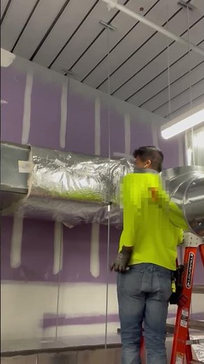 Taping fiberglass duct wrap #airconditioner #work #construction #mechanical #insulation