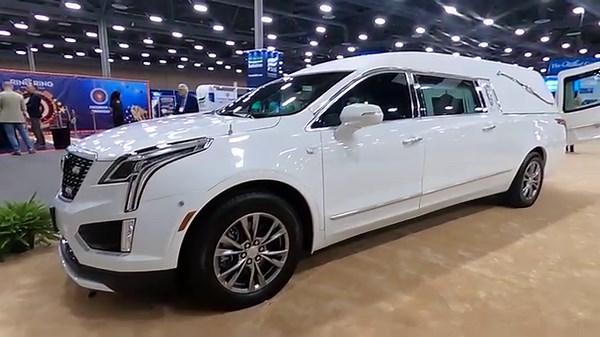 New Crystal White Tricoat '23 Eagle Coach Company XT5 Kingsley walk around at National Funeral Directors Association Las Vegas convention. #funetorium #funeralfinds #funeralhistory #funeralcoach #coachbuilt #eagle #cadillac #xt5 #kingsley #hearse #procar #nfda #lasvegas | Funetorium
