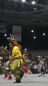 A young girl showcases her talent, dancing in traditional Native American clothing within an arena. https://www.powwowtimes.ca #NativeAmerican #TraditionalDance #Culture #Powwow #Indigenous | Powwow Times
