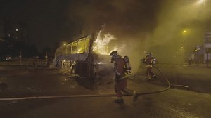 clip-3501571465-firefighters-putting-out-burning-bus-suburbs-paris