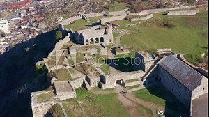 Rozafa or Shkoder castle is a hilltop archaeological park near Shkodra in Albania. Ancient fortress on top of a hill near the city of Skadar. Stone walls of medieval fortification - aerial drone view.