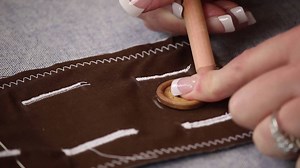 Sewing buttonholes into your finished project can be a scary task. Even experienced sewists may be intimidated. This tutorial for How to Make a Buttonhole will wipe those fears away. | AllFreeSewing