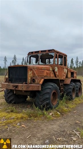 Built like a tank, forgotten like scrap metal, a mysterious homemade logging truck abandoned to rot in a cleared field. | Abandoned places