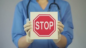 Doctor Holding Stop Sign Warning About Stock Footage Video (100% Royalty-free) 16258330 | Shutterstock