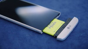 LG's modular smartphone lets you swap in attachments like batteries, camera grips, or audio converters. | The Verge