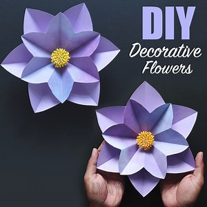 DIY DECORATIVE PAPER FLOWERS | How to make Paper Flowers | Large Paper Flowers Supplies Needed: Craft sheets Glue Scissors Marker Ruler Cutter Decorative Paper Flowers. For this amazing DIY paper flower - You will need a square sized craft papers for this flower. Fold the paper & cut it as shown in the video. Similarly repeat the same for others because you'll need 2 of these in total of different size to make a complete flower. Take a small pieces of yellow craft paper and cut fine fringes on t