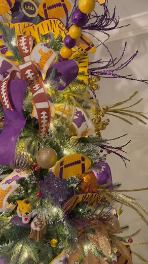 First time bringing a LSU Christmas tree into a game room… and it did NOT disappoint! 💜💛🏈 From footballs to tigers to purple-and-gold everything, this tree is officially game-day ready for the holidays. Geaux Tigers and Merry Christmas! Purple and yellow ribbon in comments: #LSUTree #LSUChristmas #GeauxTigers #TigerNation #LSUGameRoom #PurpleAndGold #LSUHolidayDecor #ChristmasTreeDecor #HolidayStyling #GameDayReady #MelroseDesign #ChristmasInTheSouth #LouisianaChristmas #LSUFans #FootballChri