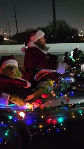 Sidecar Santa riding around indy with the grinch