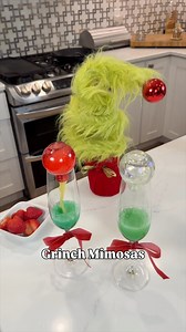 GRINCH MIMOSA MAGIC 💚✨ The most fun holiday drink for parties! Add Blue Curacao to your champagne glasses, top with mini ornament shot glasses filled with OJ, then FLIP POUR when it’s time to serve… and watch it transform from BLUE to GRINCH GREEN! 🥂💚 Finish with champagne (or sparkling cider for a kid-friendly version!) and a strawberry heart on top. 🍓🎄 Save share for your next holiday party! #GrinchMimosas #HolidayDrinks #ChristmasCocktails #ColorChangingDrink #HolidayEntertaining #Grinch