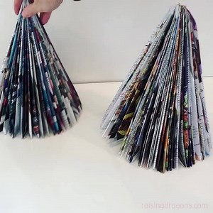 Magazine Trees 🌲 ages 6 🌲 How beautiful are these recycled magazine trees? And the best part is that they are so easy to make! All you need are some old magazines that were ready to be recycled and you can create a beautiful forest of trees! Full details >> https://www.raisingdragons.com/magazine-christmas-trees/ | Raising Dragons - Activities For Kids