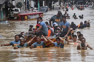 LOOK: Marikina residents seek higher ground amid major flooding caused by Ulysses