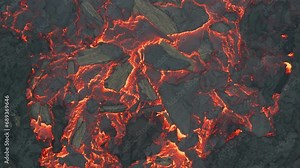 Aerial drone view over river of molten hot lava erupting from the Litli-Hrútur Iceland volcano and flows through dark rock in 2023. Tourist attraction to beautiful and dangerous disaster.