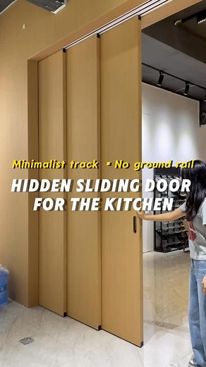 The hidden kitchen sliding door can be retracted into the cabinet when not in use, taking up little space. With a minimalist track and no floor track design, the original wood style design is both practical and aesthetically pleasing！ #slidingdoor #design #door #bedroomdoor #partitiondoor #rhj | Door Frank