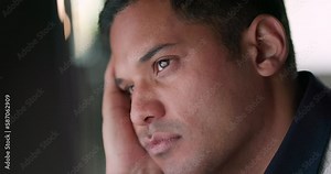 Bored businessman looking tired while working on a computer in his office at work. Corporate professional suffering from depression and feeling tired and burnout in a startup company