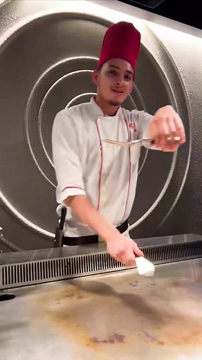 Get ready to be amazed by our incredible chef! Watch as he showcases his extraordinary spatula skills. #cheftrick