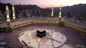 Aerial video captures the grand mosque at dusk, showcasing the Kaaba surrounded by worshippers | Premium Stock Video Footage