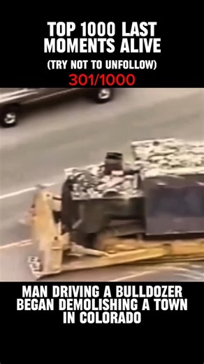 Last Moments Alive on Instagram: "Captured on the morning of June 4, 2004, this footage shows a quiet town in Granby, Colorado, being torn apart by a single armored machine. Marvin Heemeyer, a local welder and muffler shop owner, emerged in a bulldozer he had spent over a year secretly reinforcing with steel and concrete, transforming it into what would later be called the “Killdozer.” For nearly two hours, Heemeyer drove through the town, deliberately targeting buildings connected to a long-run