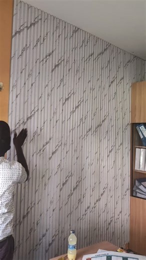 Wall Panels installation work in progress. Panels going up step by step with proper spacing, straight alignment, and a clean fitting process. The wall is gradually transforming into a refined and modern feature. Wall Panels details and pricing: • Sold per bundle • 10 pieces per bundle • Covers 2.8m height by 1.6m width • KSh 7,800 per bundle #wallpanels #wallpanelinstallation #interiorpanels #wallpanelskenya #premierwallandfloorsolutions | Premier Wall & Floor Solutions