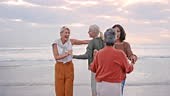 Happy, dance and senior friends at a beach dancing, laughing or...