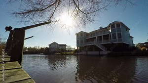 Timelapse of Sunset over Neighborhood with Natural Waterway and Boat Docks Stock Video