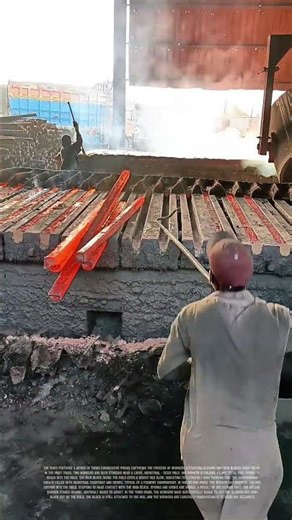 Workers Extracting Glowing Red Iron Blocks from Molds Using Tools