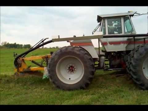 Installing tile with White 4-270 tractor with side mounted reel