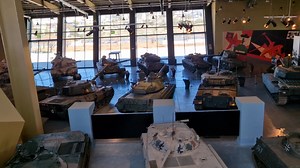 As you enter the amazing Royal Tank Museum Jordan there is a long curved walk way up to the Museum's café and the World of Tanks suite of computer games. It enables you to see a lot of the collection's vehicles from above. Normally you cannot see the top of tanks. This location lets you do that. Click the Follow and Share buttons | Craig Moore