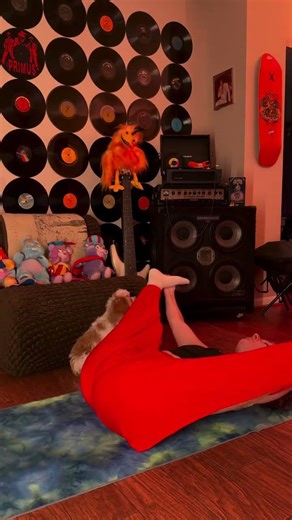 Stretching the lower back in reclined straddle pose...