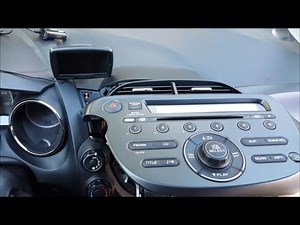 How do you replace the car radio of the Honda Jazz?
