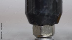 Putting a pop rivet with manual pop gun macro shot