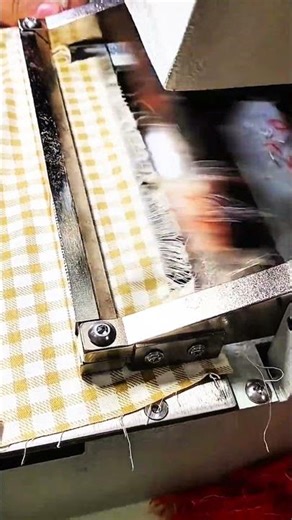 Yellow checkered fabric stitched with steady sewing machine