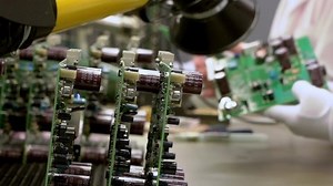 clip-1063848412-manufacturing-microcircuits-using-manual-labor-refocus-on