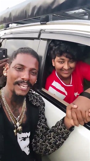 Fan takes a selfie with Darshan's cute son