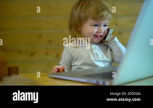 Funny Baby with laptop. Blond baby working with laptop at home. Smart little child using her laptop. Cute baby computing. Kid using a computer. Baby surprised expression in front of a laptop computer Stock Video Footage - Alamy