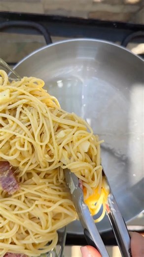 A slice of this, wrapped in a napkin, salty water on your fingertips and the sun on your face= my childhood beach snack and to this day, frittata di maccheroni (or spaghetti pie) is truly on my top 5 list of favorite foods of all times and probably always will be! Recipe in my latest book, worth it I promise!! | Laura in the Kitchen