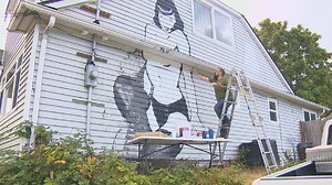 Iconic Bettie Page mural gets new paint, new addition after vandalism