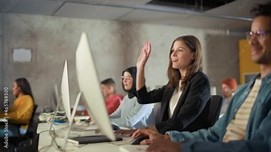 Beautiful Smart Female Student, Studying in University with Diverse Multiethnic Classmates. She Raises Hand and Asks Teacher a Question. Applying Her Knowledge to Acquire Academic Skills in Class.