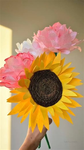 Fabillus Traits - Arts & Crafts on Instagram: "DIY Paper Sunflower | How to make a realistic Sunflower from paper Materials Used: Paper Cardboard Paint Glue #viral​ #shorts​ #diy​ #paperflower​ #sunflower​ #rose​ #craft​ #napkin #flowers #artsandcrafts ​ #homedecor​ #papercraft​ #viralshort​ #dollarstorecraft​ aesthetic home decor, dollar tree room decor, paper rose, paper sunflower, DIY paper flower making, Napkin flower tutorial, How to make flowers from Paper, paper craft flowers, floral DIY,
