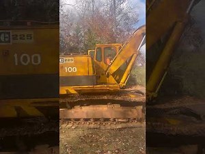 Cat D6C and cat 225 getting loaded onto lowboy pulled by 650 Cummins